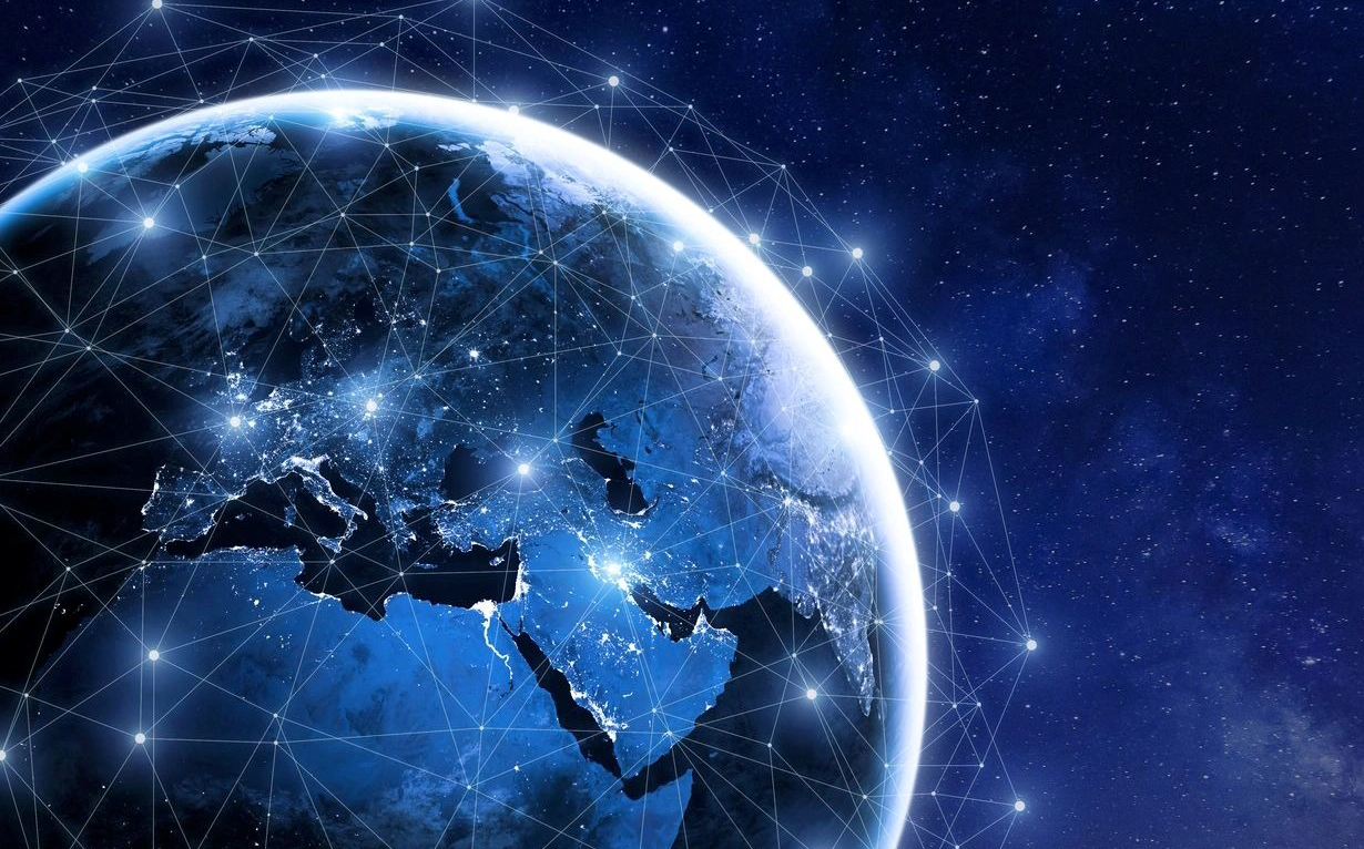 A view of Earth from space, showing illuminated regions and a network of connected lines across continents, representing global connectivity.